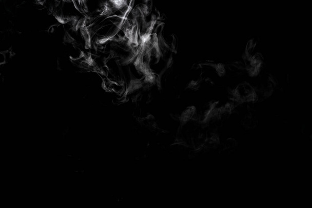 Abstract powder or smoke effect isolated on black background - Photo, Image