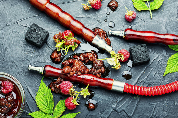 Oriental hookah with tobacco with the aroma of raspberry jam.Eastern shisha - Photo, Image