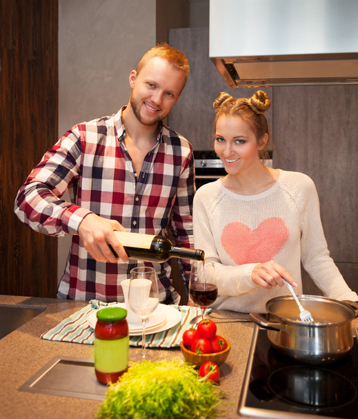 Happy couple cooking pasta - Photo, Image