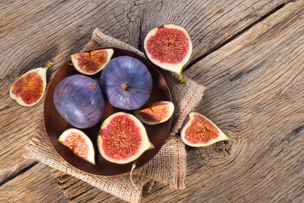 Fig fruits on wooden background top view - Photo, Image