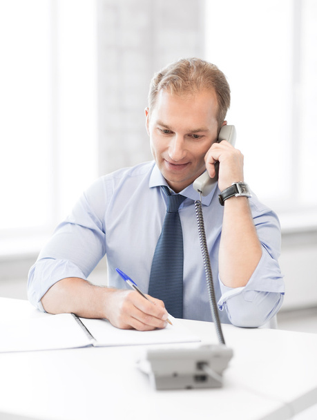 Handsome businessman talking on the phone - Photo, Image