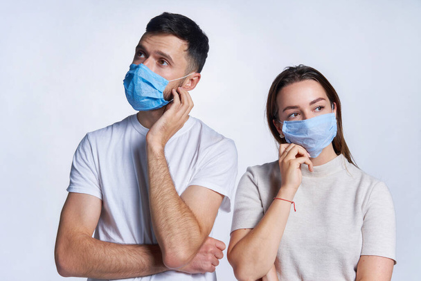 Young couple wearing medicine masks - Foto, imagen