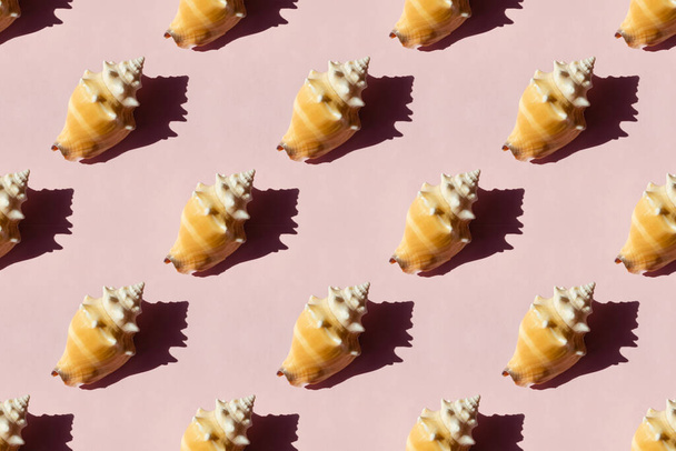 Seashells on pink background, seamless pattern - Фото, изображение