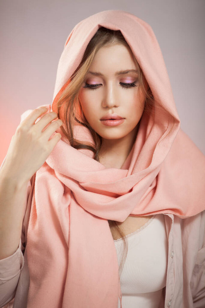 Portrait of a beautiful mysterious woman wearing a headscarf. - Foto, Bild