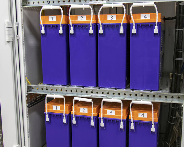 Batteries in the server's uninterruptible power supply unit to supply power to the server during the shutdown phase, rows of batteries in the industrial backup power system - Photo, Image