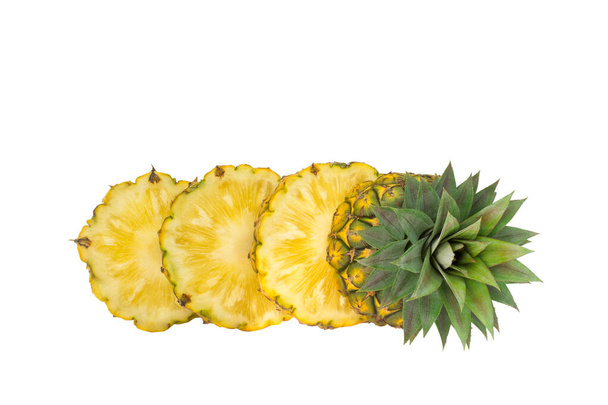  whole pineapple and pineapple slice. Pineapple with leaves isolate on white. Full depth of field. summer fruits, for a healthy and natural life, - Photo, Image
