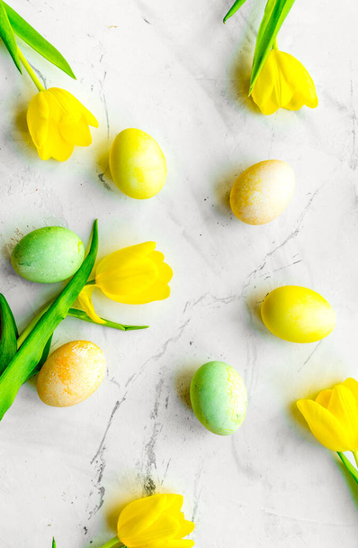 Easter concept eggs with tulip top view pattern - Photo, image