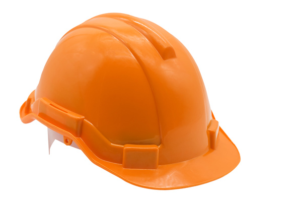 Orange hard hat or helmet isolated on white background. Industrial workers or construction site safety equipment concept. - Photo, Image