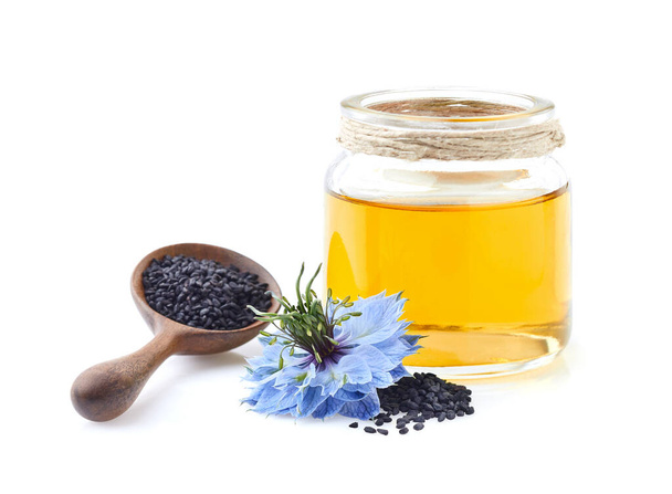 Black cumin oil with seeds on white background - Fotografie, Obrázek