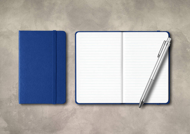 Marine blue closed and open lined notebooks with a pen . Mockup isolated on concrete background - Fotó, kép