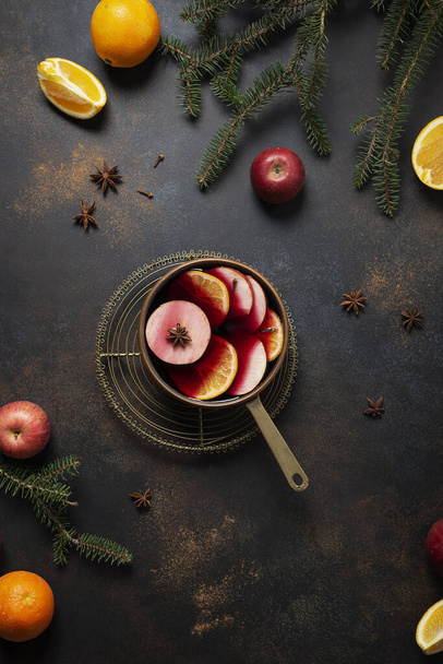 Winter mulled wine with orange, apple, cinnamon and anise star, winter concept - Фото, зображення