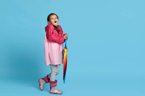 cute child girl with multicolored umbrella - Foto, immagini