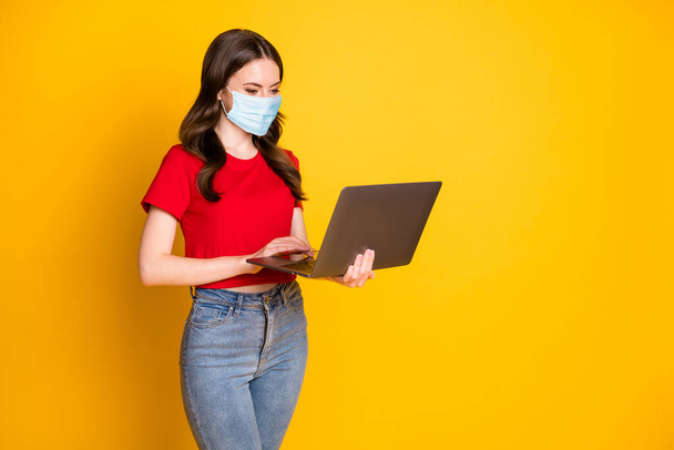Profile side photo of positive girl work laptop wear respirator isolated over bright shine color background - Foto, afbeelding