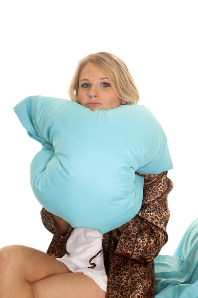 woman in animal print robe blue sheets chin on pillow - Zdjęcie, obraz