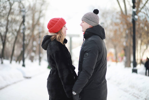 Young couple walking through the winter city - Фото, изображение