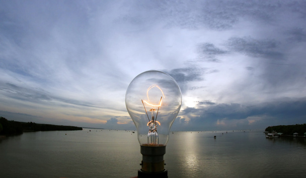 lightbulb on beautiful sky background - Photo, Image