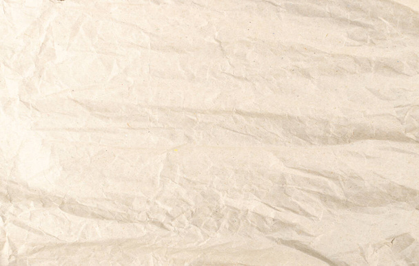 Смятая бумага Крафт Текстура фона. Морщинистый и выпрямленный шаблон оберточной бумаги, трафарет с копировальным пространством. Creased Page Обои - Фото, изображение