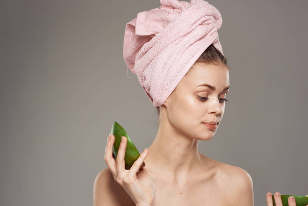 Beautiful woman with bare shoulders Exotic pure skin Mango in hand - Zdjęcie, obraz