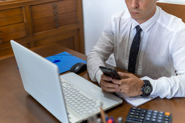 A young businessman working from home - Photo, Image