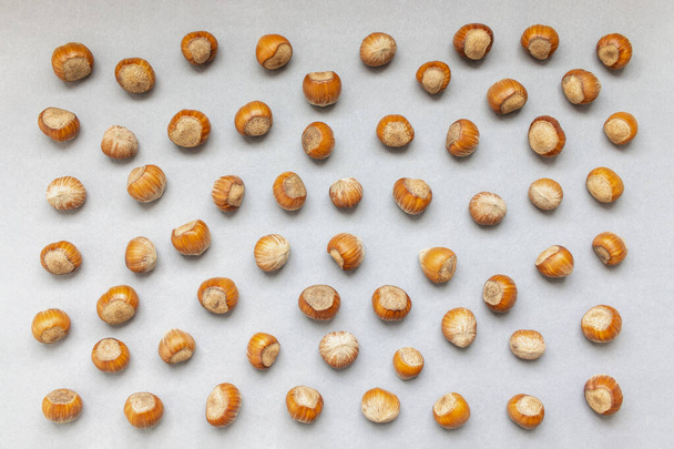 Nuts pattern on gray background, top view. - Photo, Image
