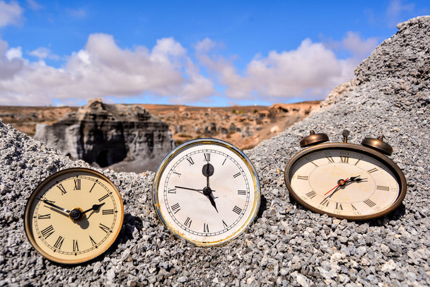 Conceptual Photo Picture of an Alarm Clock Object in the Dry Desert - Photo, Image