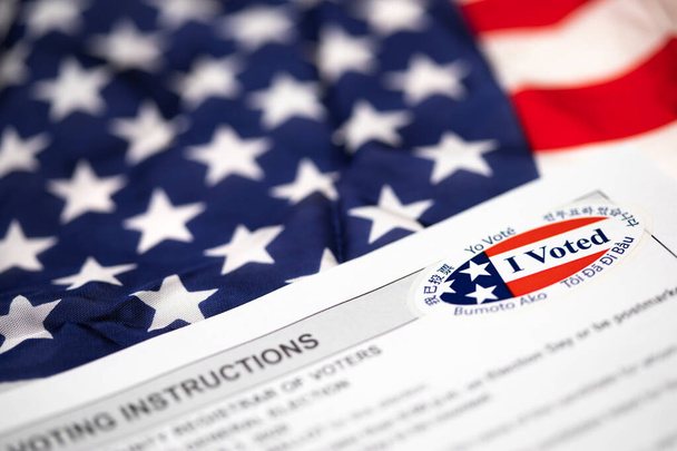 Voting Instructions with I Voted Sticker Laying on American Flag. - Photo, Image