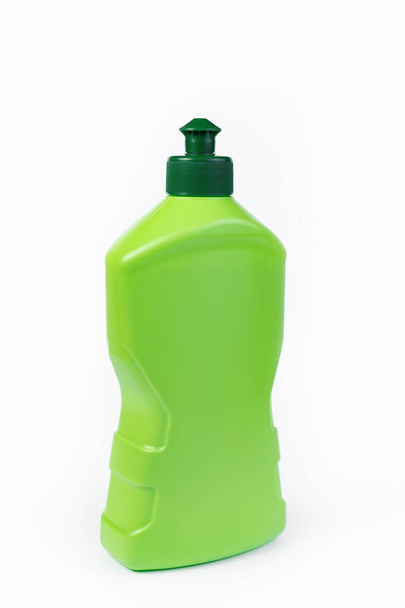 Bottle of dishwashing detergent on white background. - Фото, изображение