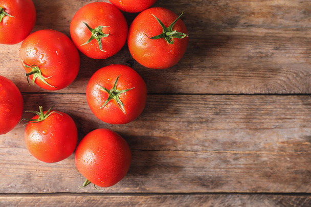 Fresh ripe tomatoes on wooden table, flat lay. Space for text - Fotoğraf, Görsel