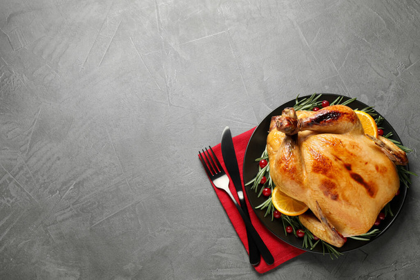 Delicious cooked turkey served on grey table, flat lay with space for text. Thanksgiving Day celebration - Φωτογραφία, εικόνα