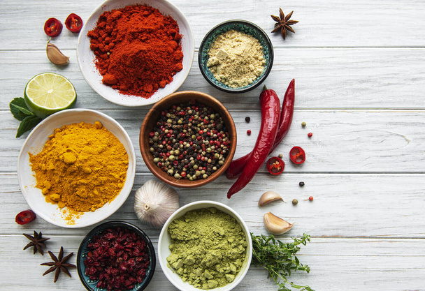 Various spices  on white wooden background, top view - Photo, Image