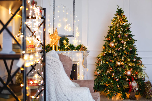 Christmas home room with Christmas tree and festive bokeh lighting. Christmas background. - 写真・画像