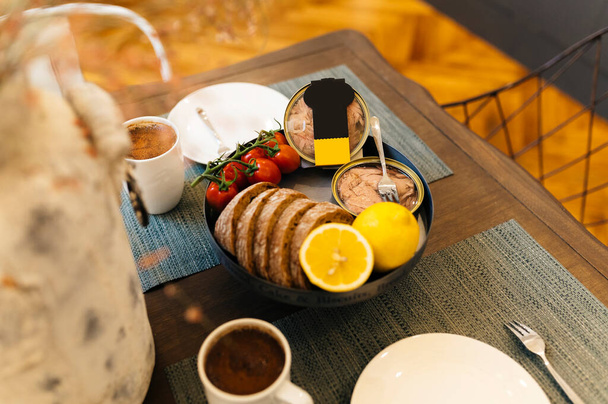 Delicious breakfast with coffee and tuna with bread. - Zdjęcie, obraz