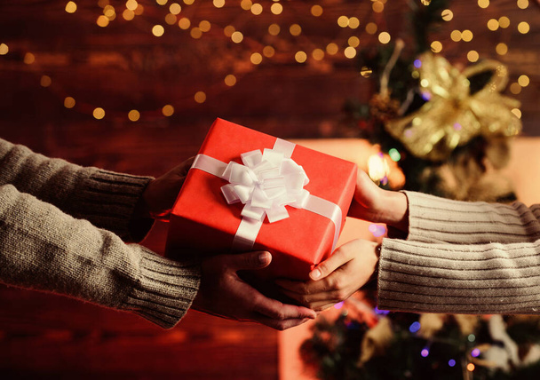 New Year is coming. present for xmas holiday. gift with love. man give woman box. family values. loving each other. hands of couple in love. merry christmas. happy new year. winter holiday weekend - Foto, afbeelding