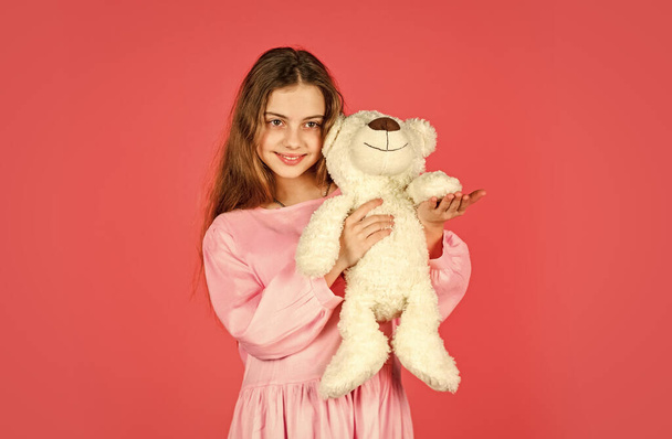 just smile. best present ever. valentines day. kid at toy shop. feeling carefree and cosy. small girl hold teddy bear. retro girl play with bear toy. happy childhood. gift for birthday holiday - Photo, Image