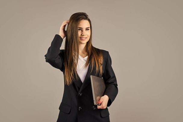 Another working day. confident office worker. fashion beauty look. formal fashion style. brunette woman with trendy makeup. sexy girl in jacket hold laptop. successful woman work online on computer - Φωτογραφία, εικόνα