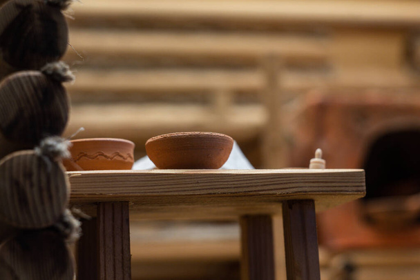 a pitcher of clay on the table - Φωτογραφία, εικόνα