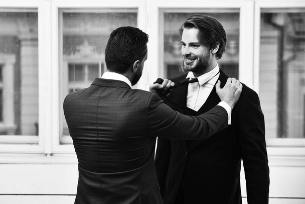 business conflict, confident men or businessmen fight with tie - Фото, изображение