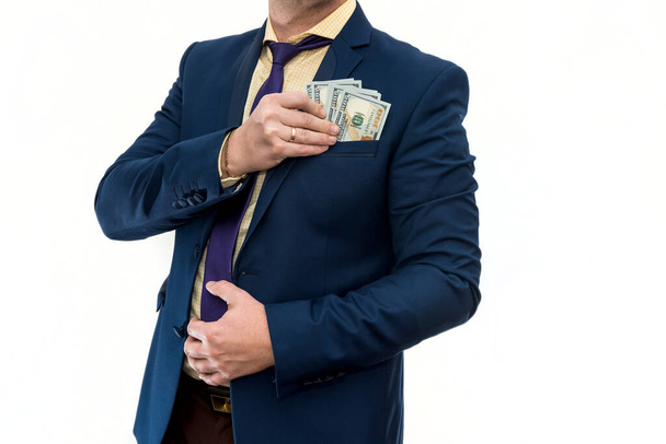 Деловой человек держит и считает деньги. Доллар в мужской руке, изолирован на белом. Концепция экономии - Фото, изображение