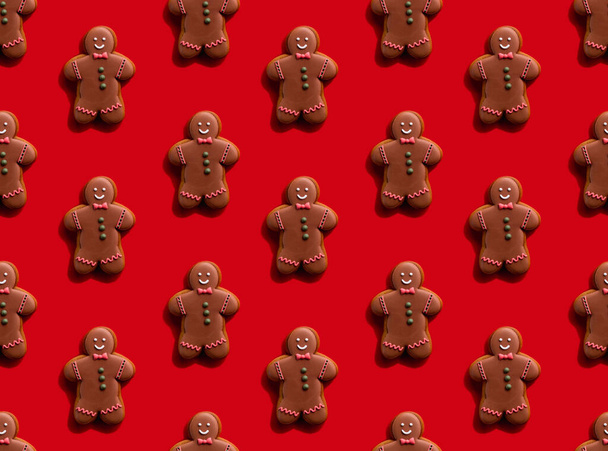 gingerbread man pattern red seamless background - Foto, immagini