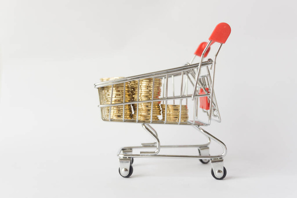 Coins on shopping cart. - Фото, зображення