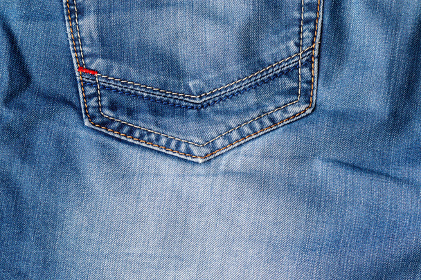 Mavi kot kumaş kumaş. Arka cebi bozuk kot pantolon - Fotoğraf, Görsel