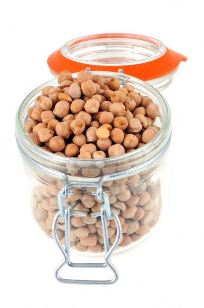Jar of dried chickpeas opened close up on white background | Bocal de pois chiches secs ouvert en gros plan sur fond blanc - Photo, Image