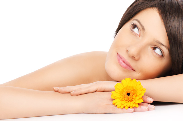 Woman relaxing with a flower - Photo, Image