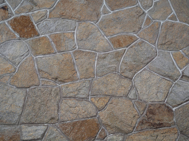 A closeup shot of a colorful stone wall - perfect for background - Foto, imagen