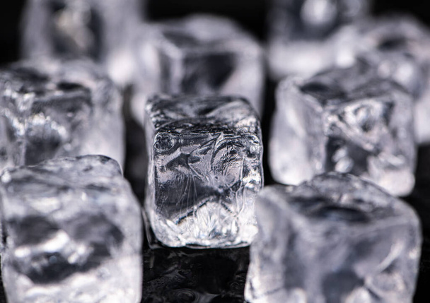 Ice Cubes on dark background as detailed close-up shot; selective focus - Valokuva, kuva