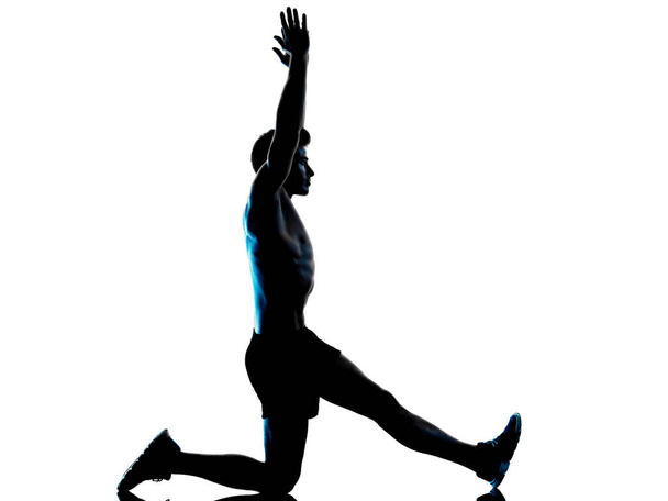 young man fitness exercise exercIsing shadow isolated white background silhouette - Valokuva, kuva