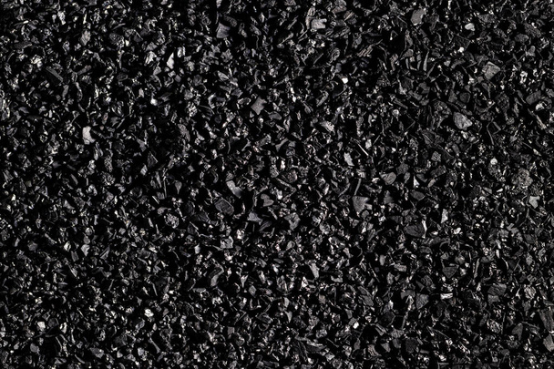 Primo piano della texture in carbone attivo nero. Carbone di cocco. - Foto, immagini