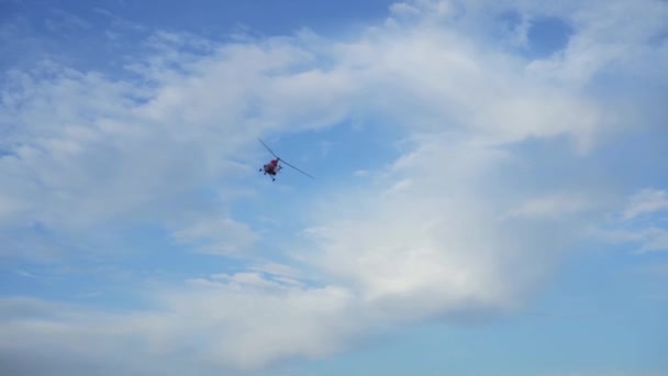 Helicopter maneuvers in the sky. Aerial patrolling of the territory. - Felvétel, videó