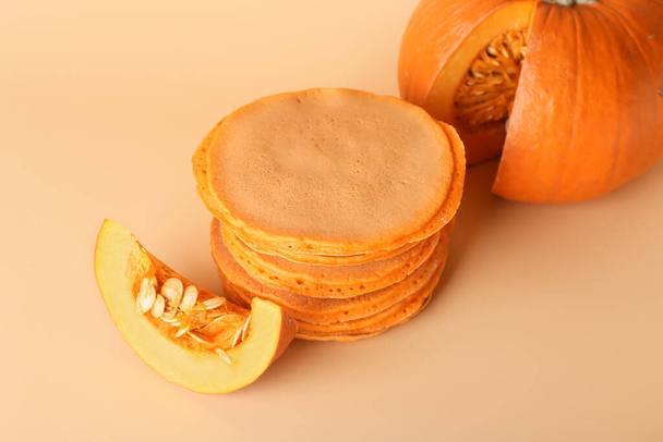 Tasty pumpkin pancakes on color background - Foto, immagini