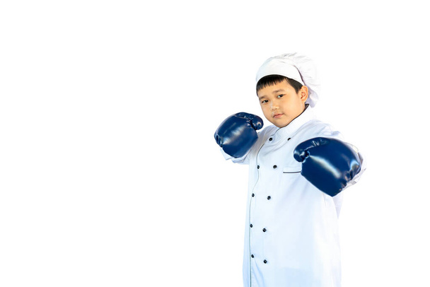 portrait asian boy wear blue boxing gloves and chef suit - cook hat stand acting fight or boxing concept isolated on white background with clipping path - Foto, Imagen